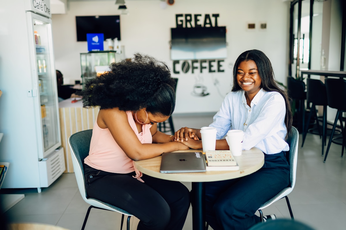 African women practicing IT skills on a laptop
